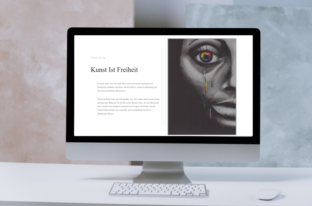 Mockup einer Webseite mit der Aufschrift "Kunst ist Freiheit" und einem künstlerischem Portrait